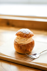 A traditional semla sweet bun dessert with almond paste topped with whipped cream
