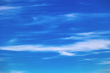 Blue sky with clouds. Bright sky