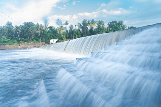 A beautiful view of a waterfall from a check dam In Kerala, India.
