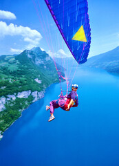 Paraglider Pilot over the Walensee, Kanton St. Gallen, Switzerland - obrazy, fototapety, plakaty