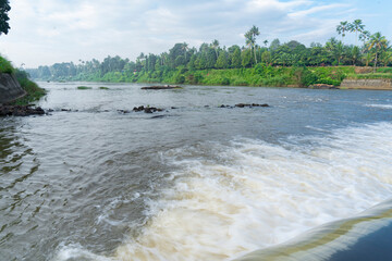 A beautiful view of a waterfall from a check dam In Kerala, India.