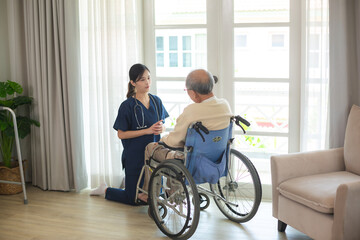 Young asian female nurse care giver helping asian senior old man in living area of nursing home senior daycare center, Nurse take care elderly patient with cheerful concentrate, health insurance - obrazy, fototapety, plakaty