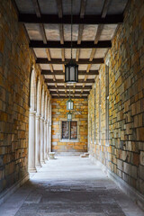 Serene Historical Corridor with Arches and Lanterns, University of Michigan