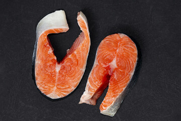 Fresh raw salmon , trout, steak on dark background. Slice of fresh raw fish.