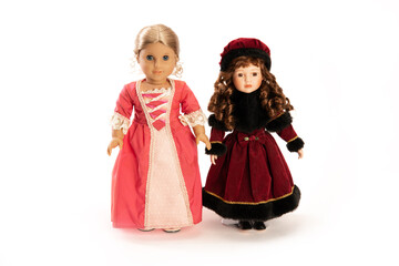 two beautiful dolls on a white background