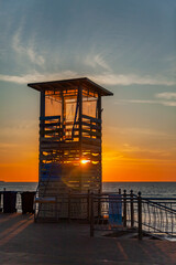 Zelenogradsk, Russia, June 15, 2023. Lifeguard tower on the sea embankment at sunset time - 741854967