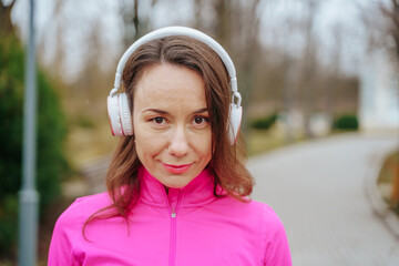 Close up photo of beautiful senior caucasian woman with headphones.
