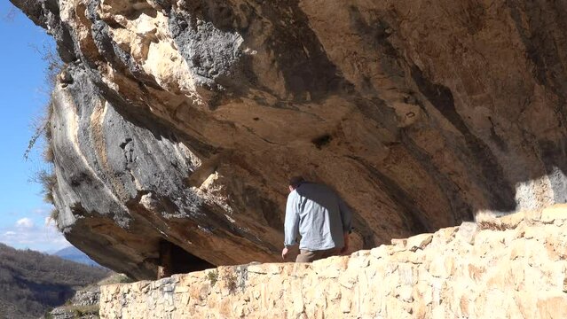 Roccamorice, Italy A man walks into the Hermitage of San Bartolomeo, an ancient abbey carved into the rock. 