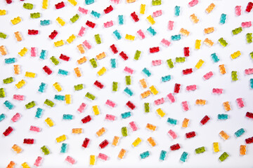 Fototapeta na wymiar Colorful Gummy Bears Texture Background - Sweet Candy Delights on White