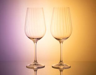 Artistic composition of glassware enhanced by dynamic colored lighting for creative photography
