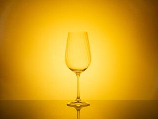 Elegant glassware display illuminated by captivating colored lighting, ideal for creative concepts