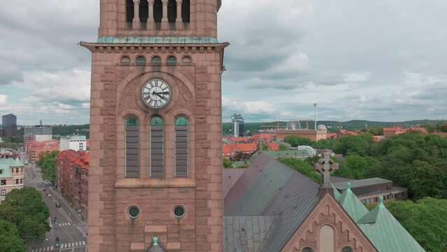 A view of the Vasa church in Gothenburg, Sweden , Amusement park Liseberg in Gothenburg, tower with a cloudy blue sky in the background, Aerial view, Old building , Coastline of Scandinavian city