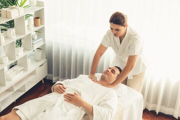 Caucasian man customer enjoying relaxing anti-stress spa massage and pampering with beauty skin...