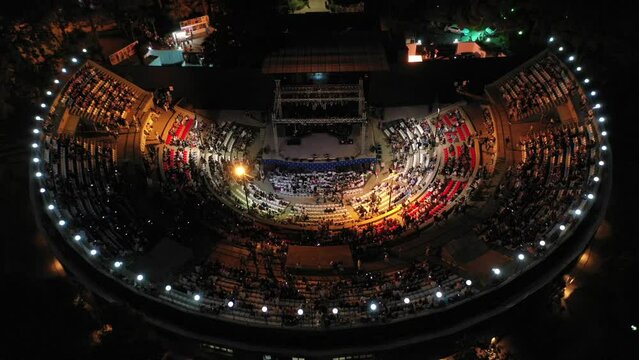 Aerial video of people watching a concert at an open-air theater