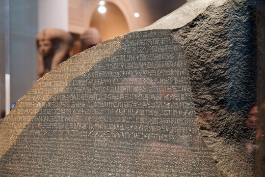 Rosetta Stone in a public gallery in the British Museum. Hyroglyphs, and demotic script can be seen. 