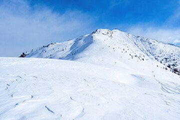 Winter landscape with snow covered Dolomites in Kronplatz, Italy