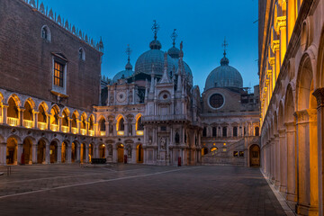 Fototapeta na wymiar Venice, Italy - February 6, 2024: Courtyard of the Doge's Palace (Palazzo Ducale) in Venice. San Marco basilica in background