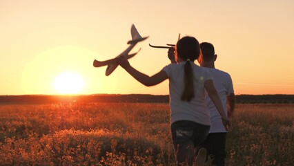 child airplane, children dream airplane pilot, child kid boy girl running with toy airplane across...