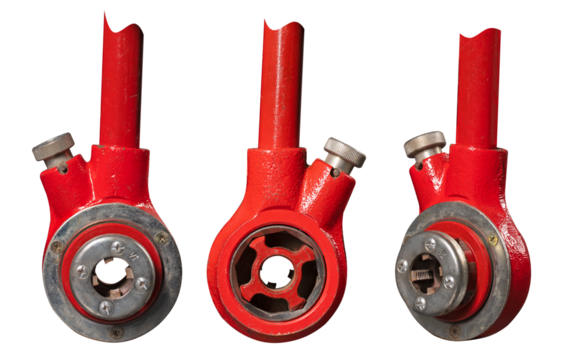 Old pipe threader used by plumbers for household repairs. Isolated background.