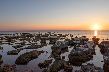 Rocks on sea in sunset - 741912178