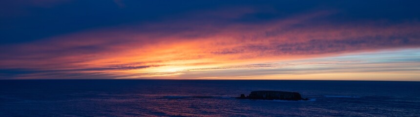 Naklejka na ściany i meble Sunset over Ottere Rock on the Oregon coast near Newport