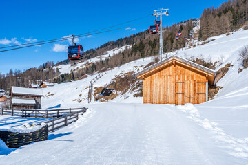 Cable car on top of a mountain at Kronplatz, a popular winter sports destination in Italy.