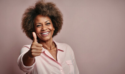 Beautiful happy afro american lady with thumb up, isolated on pink background - obrazy, fototapety, plakaty