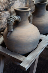 Fototapeta na wymiar Old terracotta clay kitchenware jars and pots, ancient cookware