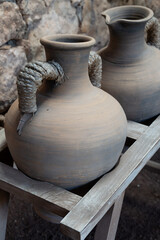 Fototapeta na wymiar Old terracotta clay kitchenware jars and pots, ancient cookware