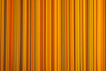 Food background, colorul dried pasta spaghetti, paralleled lines, wallpapers with stripes