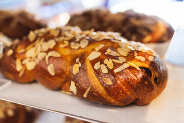 Tsoureki, Traditional Greek Easter Bread, greek freshly baked cake in Athens, Greece, with almond, mastiha, mahleb and cinnamon, orthodox Easter in Greece, sweet bread with red eggs