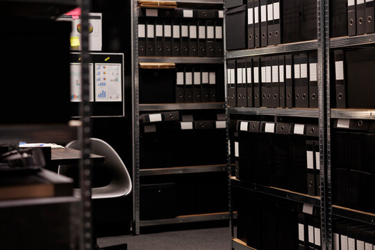 Empty detective space equipped with metallic storage full with criminal cases documents. Arhive room in police station is a secure location where crime evidence is stored during investigation