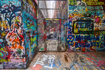 Graffiti Alley Security Door, Urban Art Chaos, Eye-Level View