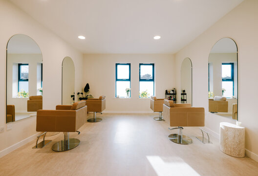 Opulent Hair Studio Showcasing Contemporary Styling and Top-of-the-Line Gear, Crafting an Upscale Oasis for Pampering and Glamour - Powered by Adobe