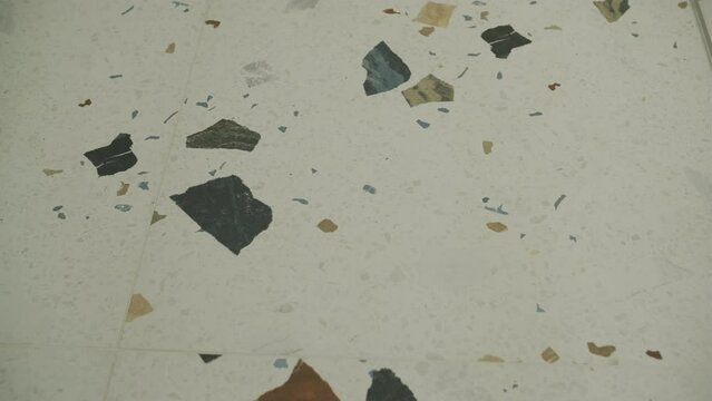 Terrazzo marble flooring seamless texture. Natural stones, granite, marble, quartz, limestone, concrete. Beige background with colored chips.
