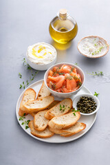 Making salmon crostini or bruschetta with smoked salmon