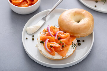 Bagel with smoked salmon, capers and red onion for breakfast