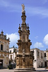 Fototapeta na wymiar The Spire of the Immaculate Conception is a beautiful Baroque monument in the town of Nardò in Puglia, it represents a symbol of devotion and a point of reference for the community of Nardò