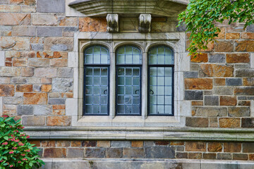 Fototapeta na wymiar Neoclassical Window Design in Stone Wall at University Campus