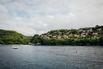 Fototapeta na wymiar View of houses on the coastline near Soufriere in Saint Lucia in the Caribbean 