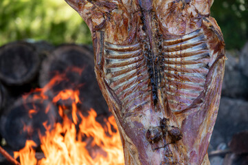 Close-up of a lamb on the spit. Classic Patagonian barbecue from Argentina.
