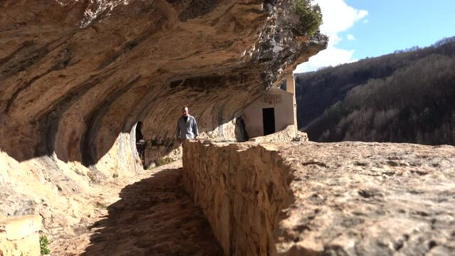Roccamorice, Italy A man walks into the Hermitage of San Bartolomeo, an ancient abbey carved into the rock. 
