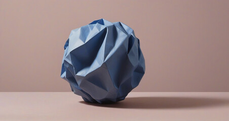 crumpled paper ball on blue
