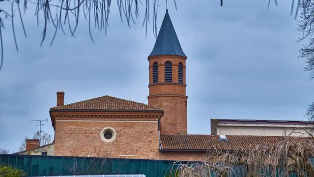 Tower of Church Saint Exupere Parish on 6 Lamarck Street near Museum of Toulouse, France.