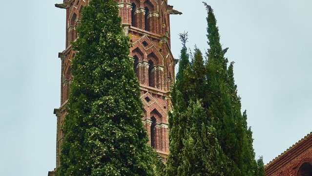 TOULOUSE, FRANCE - MARCH 20 2018: Convent tower seen from cloister. Church of Jacobins is a deconsecrated Roman Catholic church located. Relics of Thomas Aquinas are housed there.