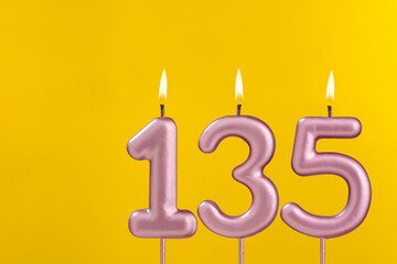 Candle 135 with flame - Birthday card on yellow luxury background