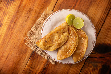 Pescadillas. So called when they are stuffed with fish such as tuna, popular during the Lent season. They are known as Golden Quesadillas when they are filled with ingredients such as meat or potatoes