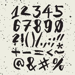 Vector handwritten calligraphic ink alphabet, numbers and symbols, black on white background. Hand drawn alphabet written with brush pen.