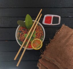 Noodle with chopsticks in a bowl