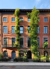 Historic vine covered apartment buildings on 9th Street in the Greenwich Village neighborhood of New York City